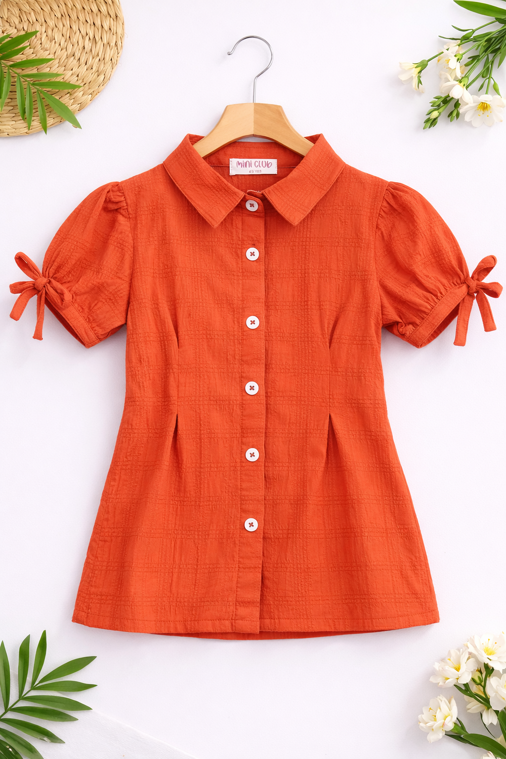 Terracotta shirt with floral accents